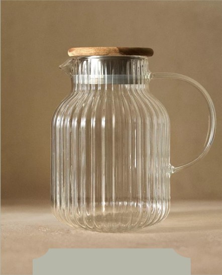 Fluted glass pitcher with a wooden lid